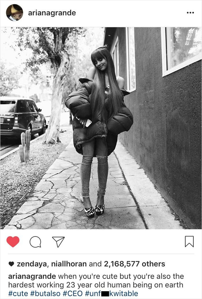 Black and white photo of a celeb wearing oversized jacket and heels, showing how out-of-touch celebrities try to be relatable.