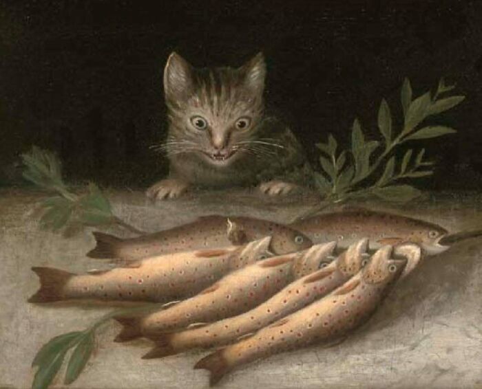Vintage cat watching a group of fish on a table, capturing classic charm and curiosity from past centuries.