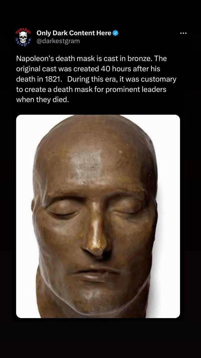 Bronze death mask cast of Napoleon with closed eyes, featured on darkest page on Instagram with creepy stories.