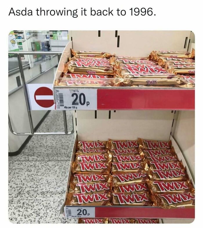 Display of Twix chocolate bars priced at 20p in a UK store, featuring chaotic British memes referencing nostalgic UK culture.