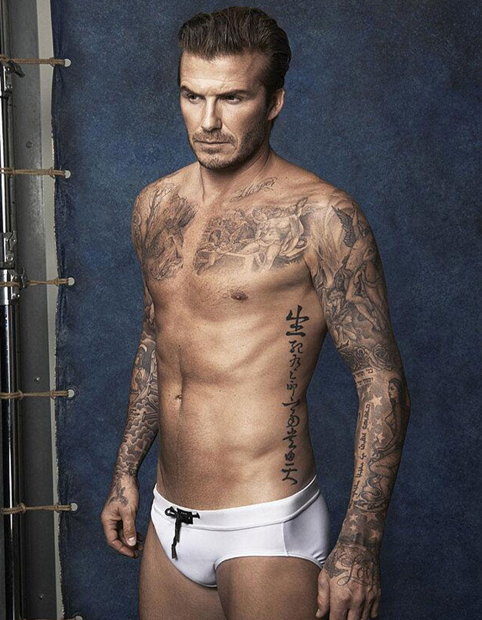 David Beckham in white Speedo, showcasing tattoos and fit physique in a studio setting, related to Cruz Beckham's bulge viral moment. David Beckham in white Speedo, showcasing tattoos and fit physique in a studio setting, related to Cruz Beckham's bulge viral moment.