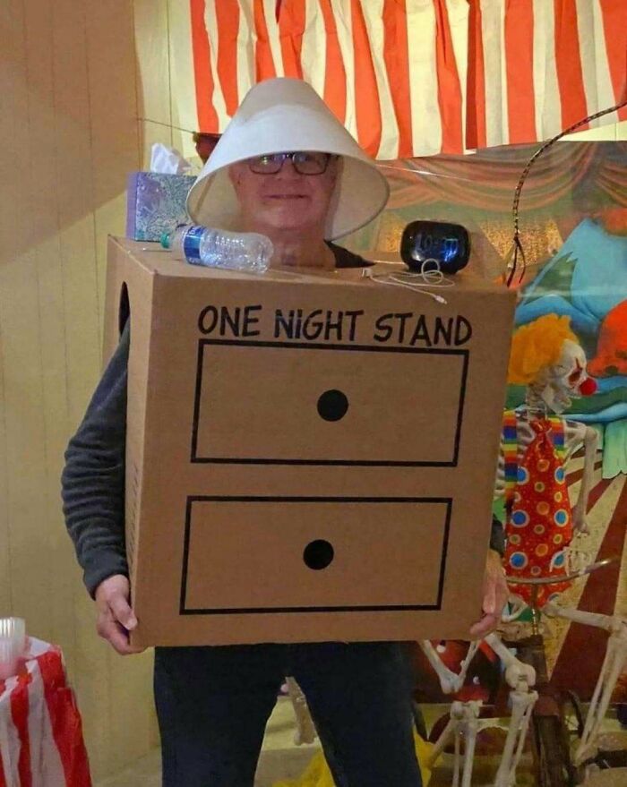Person wearing a creative costume made from a cardboard box labeled one night stand, showcasing ingenious crafty ideas.