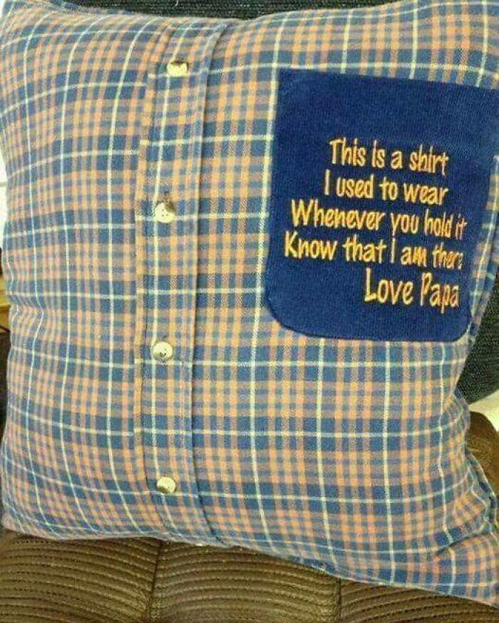 Plaid shirt transformed into a pillow with a stitched message on the pocket, showcasing ingenious crafty ideas for keepsakes.