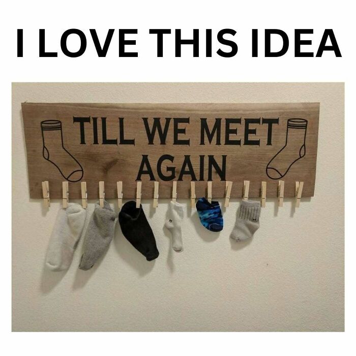 Wooden wall sign with clothespins holding socks as a crafty idea from a popular IG account sharing ingenious crafty ideas.