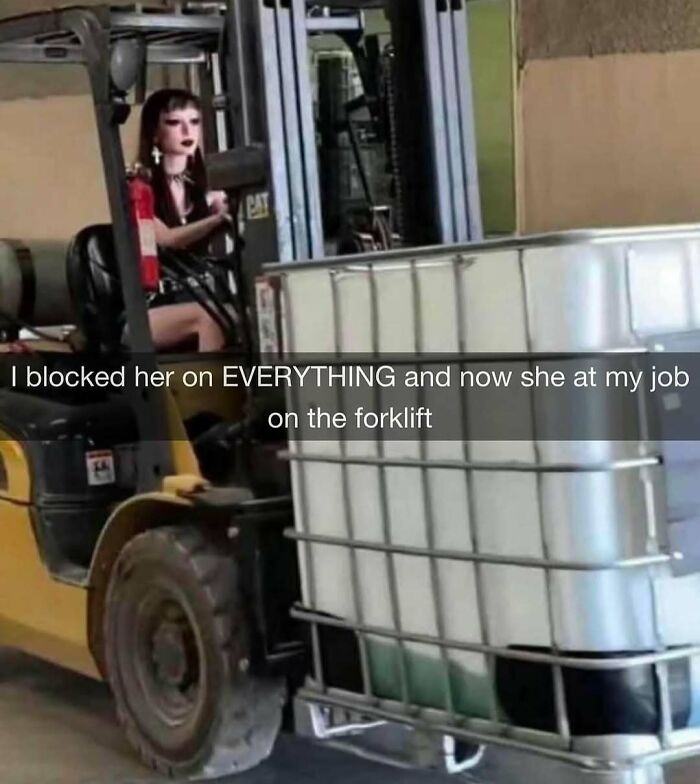 Woman with doll-like face driving forklift in warehouse, a cursed image from a popular Instagram page disturbing 200K fans.