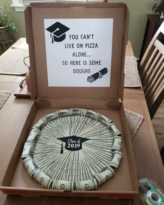 Ingenious crafty idea showing money arranged in a pizza box with a graduation theme and a witty note inside.