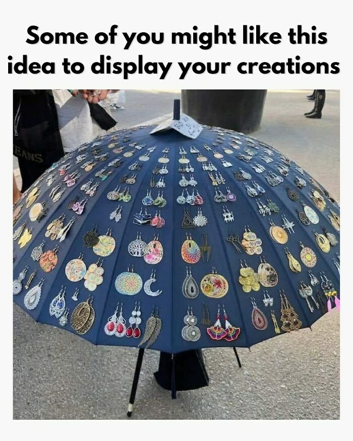 Creative crafty idea displaying earrings on an open umbrella for an ingenious and attractive presentation.