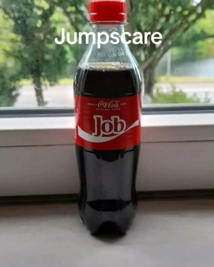 Plastic Coca-Cola bottle labeled Job with the word jumpscare above, a meme for broken sense of humor.