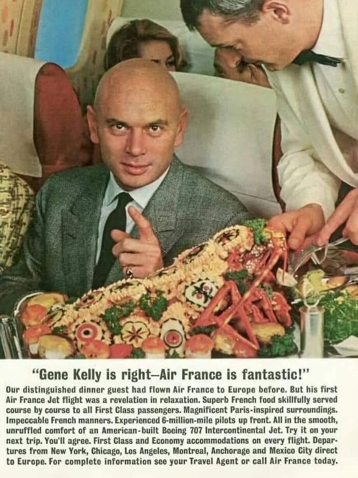 Vintage man in a suit enjoying a retro airline meal, evoking nostalgia from June Cleavers vintage closet era.