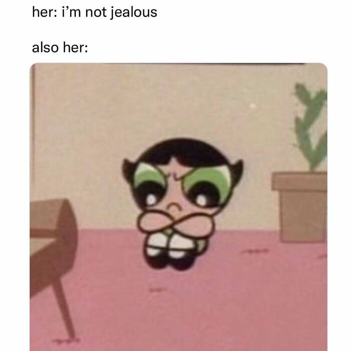 Upset cartoon character with arms crossed depicting jealousy in a funny introvert-worthy meme about emotions and behavior.