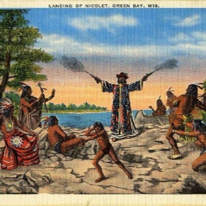 Historical photo depicting Native Americans welcoming explorers at Green Bay, Wisconsin, showcasing cultural traditions and early encounters.