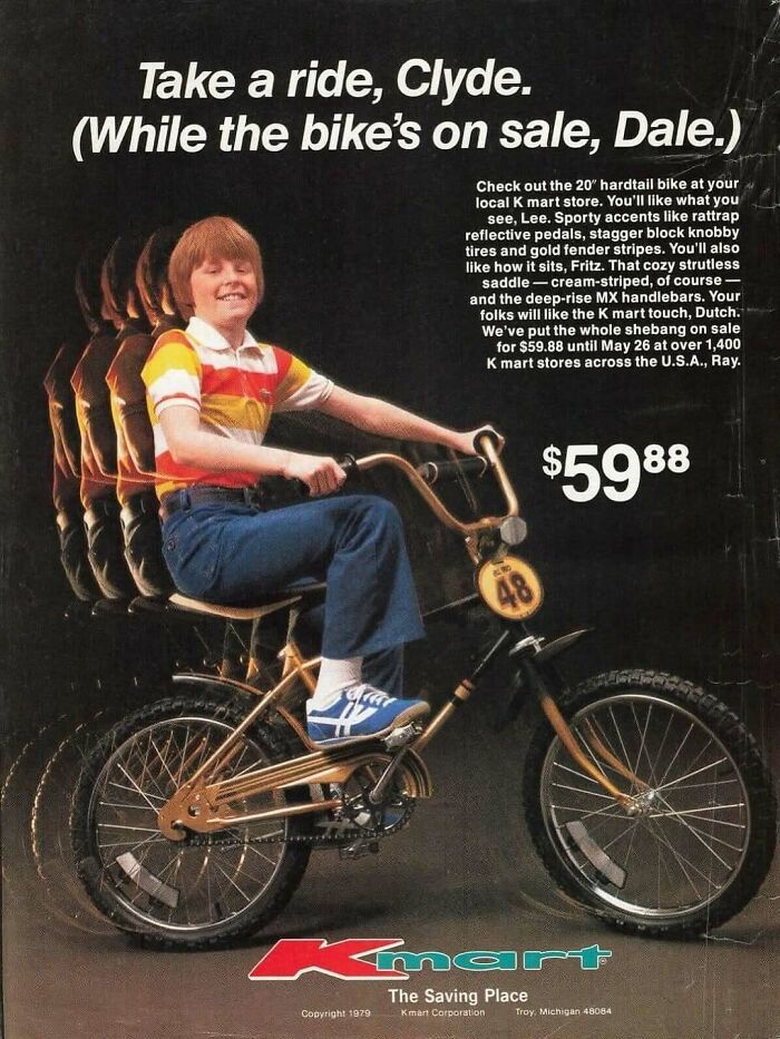Boy on vintage bicycle wearing striped shirt and jeans in an old-timey Kmart ad from the June Cleavers vintage closet era.