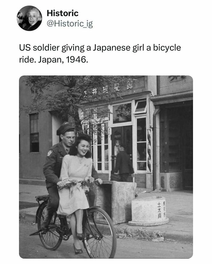 Historic photo of a US soldier giving a Japanese girl a bicycle ride in Japan, 1946, capturing a post-war moment.