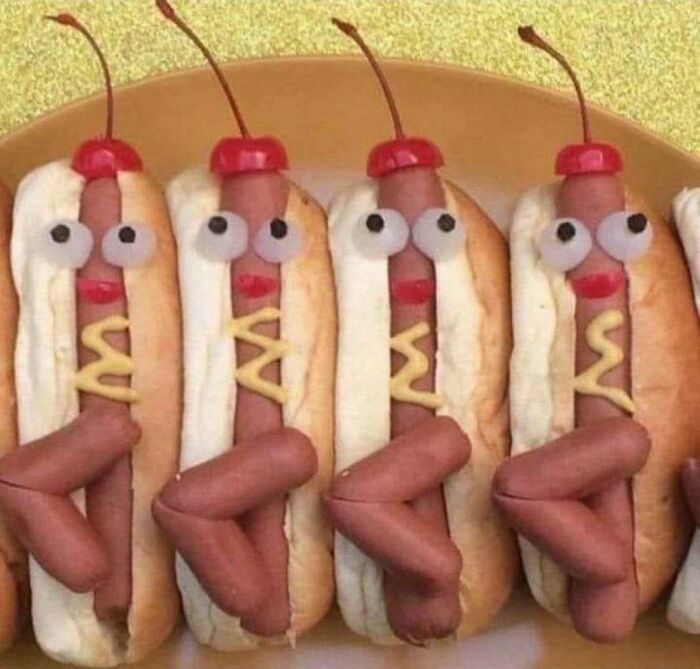 Hot dogs with legs, mustard, eyes, lips, and cherries on top, styled to evoke June Cleavers vintage closet era.