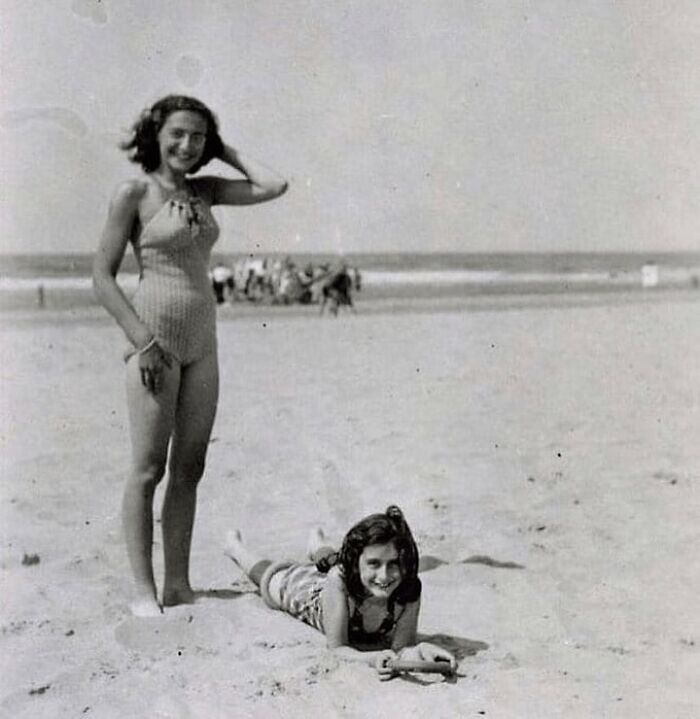 Young women enjoying a day at the beach in a historical photo capturing a moment from the past with interesting backstories.