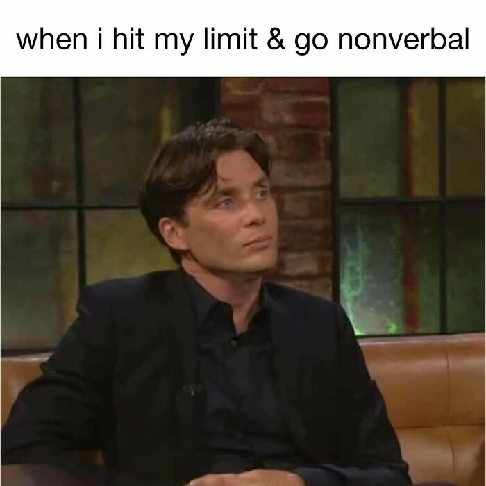 Man in black suit with serious expression, illustrating a hilarious meme for daily dose of laughter and good vibes.