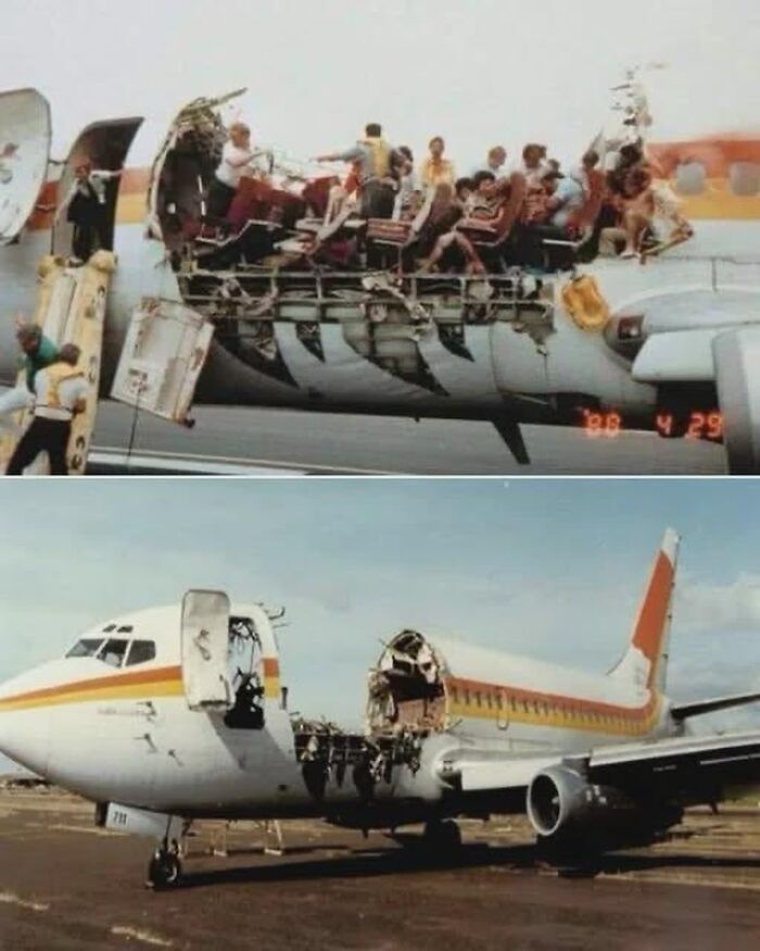 Passengers sitting in exposed seats on a damaged airplane fuselage in one of the most striking historical photos.