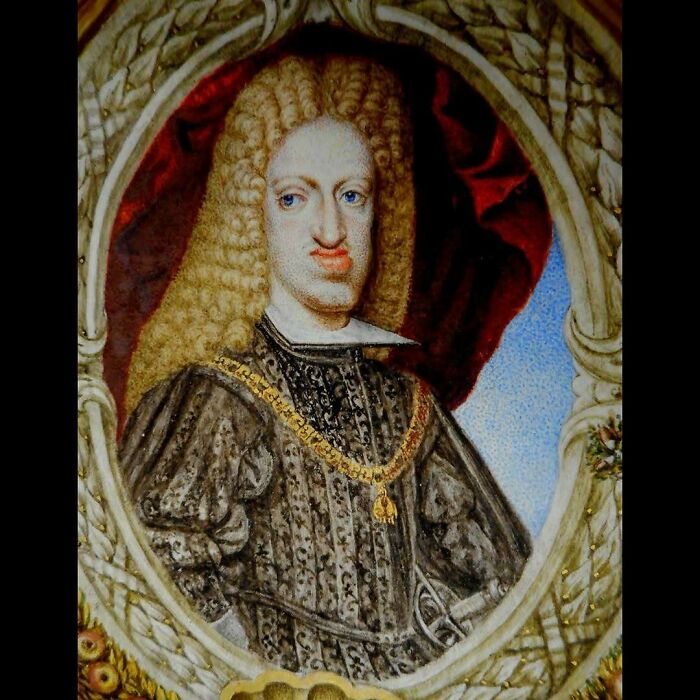 Portrait of a historical figure wearing ornate clothing and a gold chain, part of 79 historical photos collection.