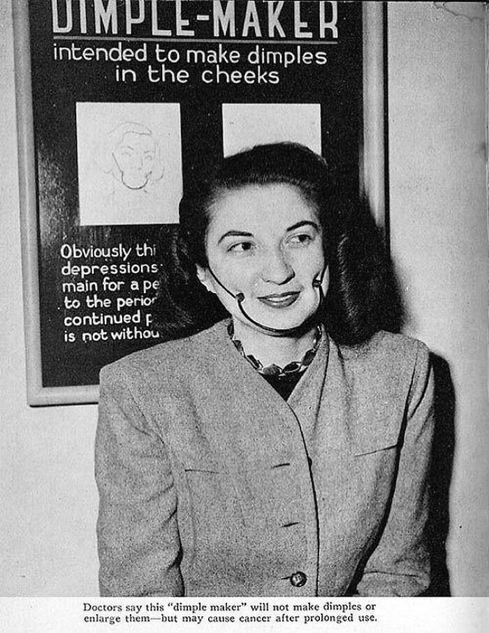 Black and white historical photo of a woman demonstrating a vintage dimple maker device with a warning about cancer risk.
