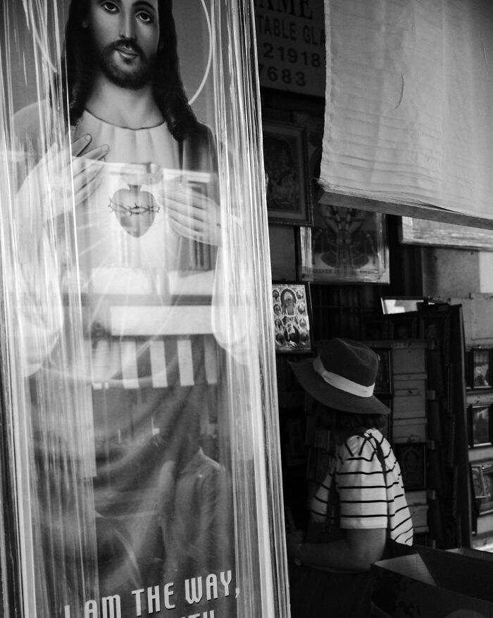 Black and white photo capturing ordinary moments transformed into poetic, cinematic images by a creative photographer.