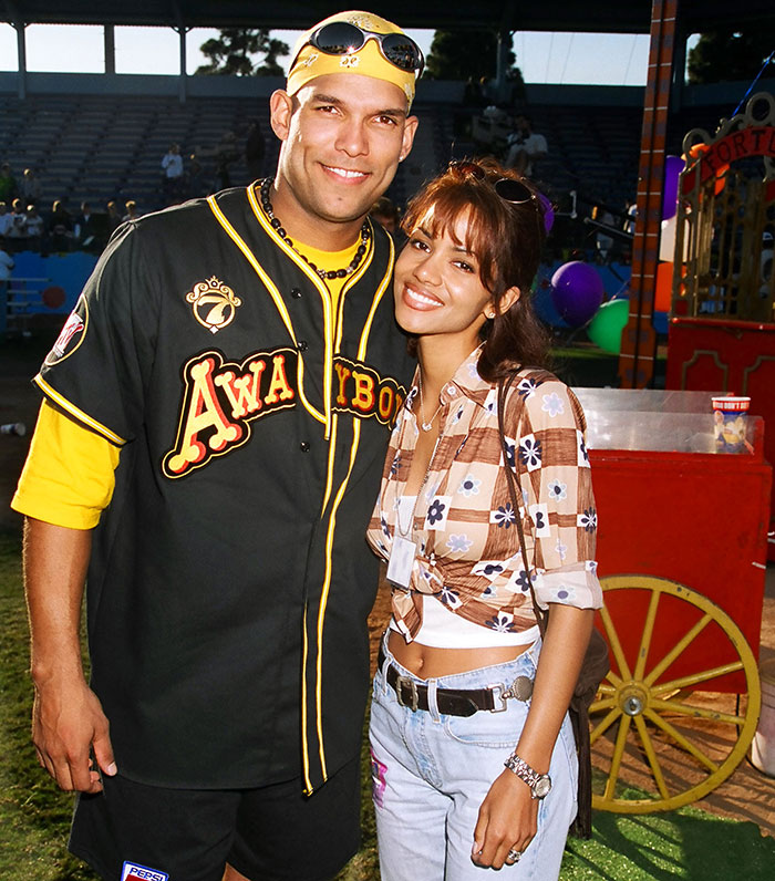 Halle Berry’s ex-husband and Halle Berry smiling together outdoors at an event during daytime. Halle Berry’s ex-husband and Halle Berry smiling together outdoors at an event during daytime.