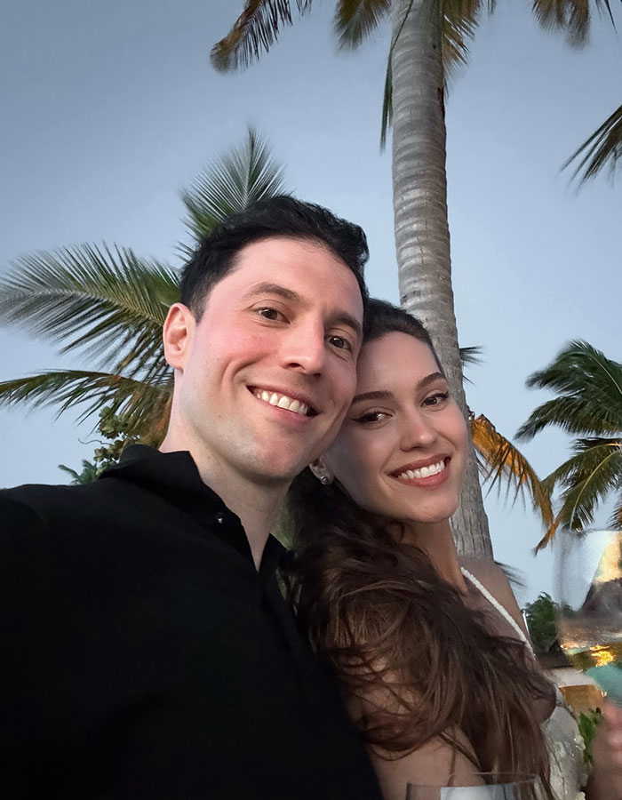 Young couple smiling outdoors with palm trees in background, related to former Miss Universe contestant elk collision accident news.