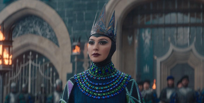 Gal Gadot in elaborate costume on a medieval film set, highlighting controversies impacting her career. Gal Gadot in elaborate costume on a medieval film set, highlighting controversies impacting her career.