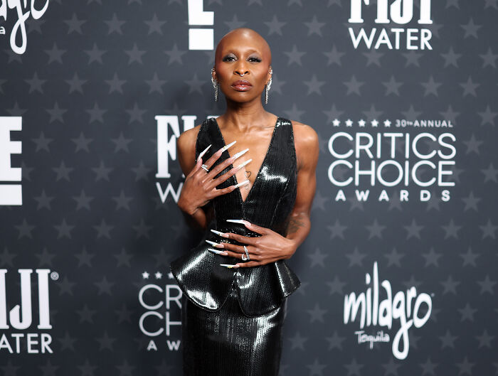 Cynthia Erivo with long nails at the Critics Choice Awards, sparking mass outrage over her portrayal of Jesus with Adam Lambert. Cynthia Erivo with long nails at the Critics Choice Awards, sparking mass outrage over her portrayal of Jesus with Adam Lambert.
