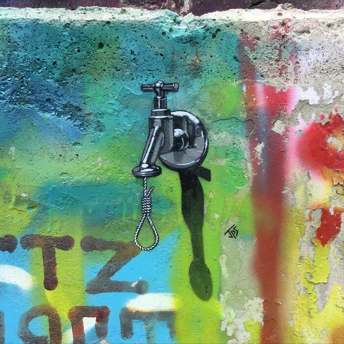 Graffiti street art of a faucet with a hanging noose, creatively interacting with the wall’s texture and colors.