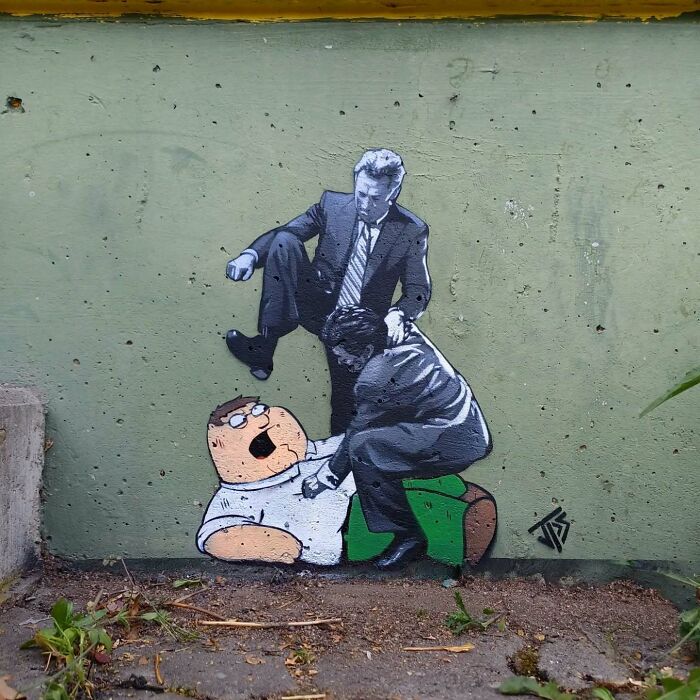 Graffiti art on a street wall showing characters interacting with surroundings, blending cartoon and realistic styles.