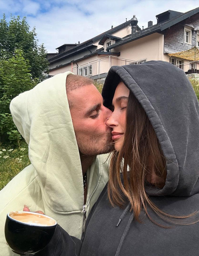 Justin Bieber kissing a woman in hoodies outdoors, sparking buzz with Kendall Jenner dive bar pic and Hailey&rsquo;s comment.