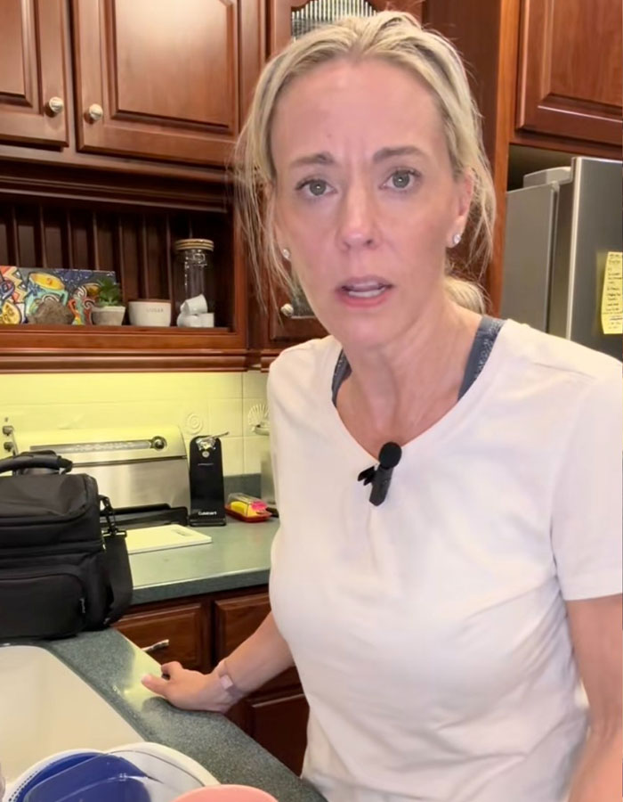 Kate Gosselin in a kitchen setting, appearing concerned, relating to reality star nursing career and downfall news.