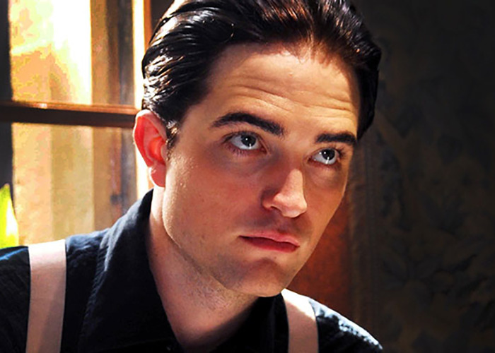 Close-up of a male movie star with slicked-back hair, highlighting moments when actors were actually doing the deed.