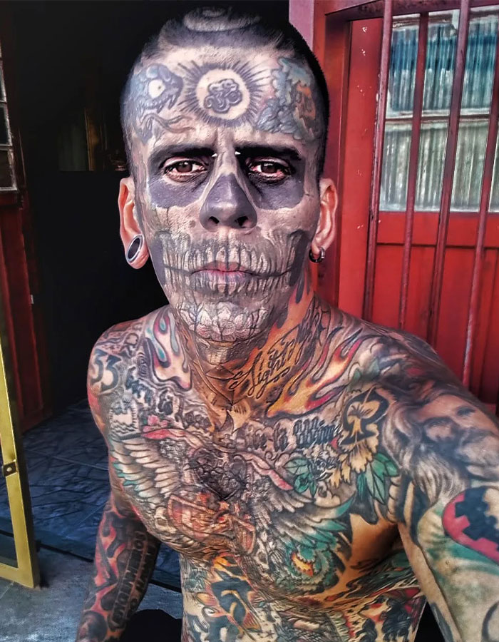 Tattooed man known as Brazilian Steve-O showing his dramatic new look after tattoo removal in natural light.