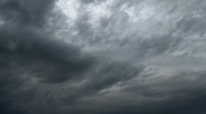 Dark stormy clouds filling the sky, symbolizing moral dilemma and question of am I the problem.