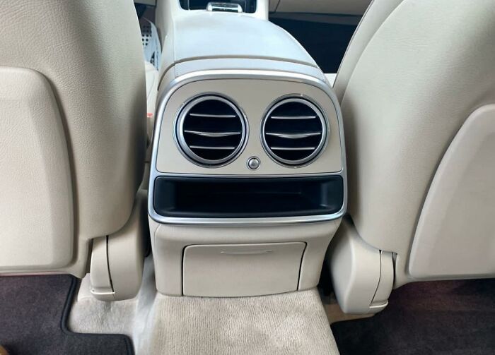 Car air vents and storage compartment resembling a face posted by members of a group sharing objects that look like faces.