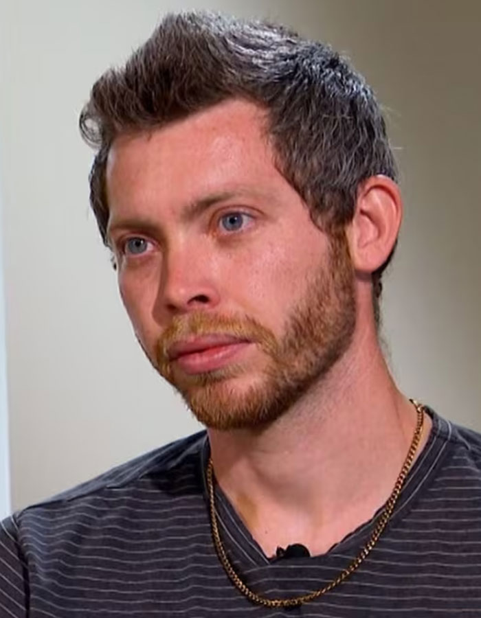 Man with beard and blue eyes in a striped shirt, sharing emotions about polygraph results in a disappearance case.