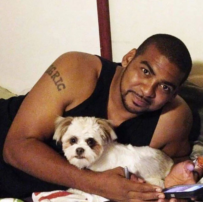 Man lying down holding a small dog, representing celebrities and important figures whose disappearances remain unsolved cases.