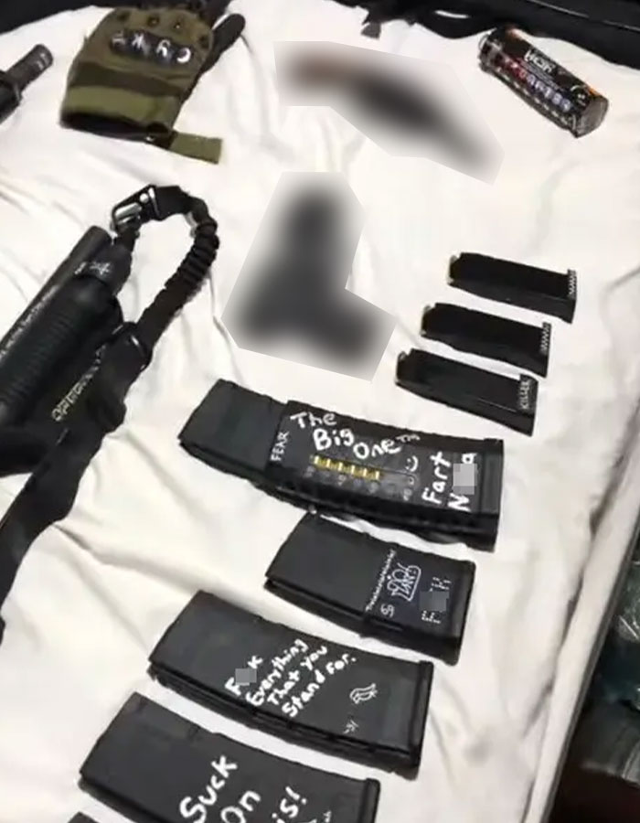 Assorted magazines, gloves, and tactical gear laid out on a surface linked to Minneapolis Catholic school suspect evidence. Assorted magazines, gloves, and tactical gear laid out on a surface linked to Minneapolis Catholic school suspect evidence.