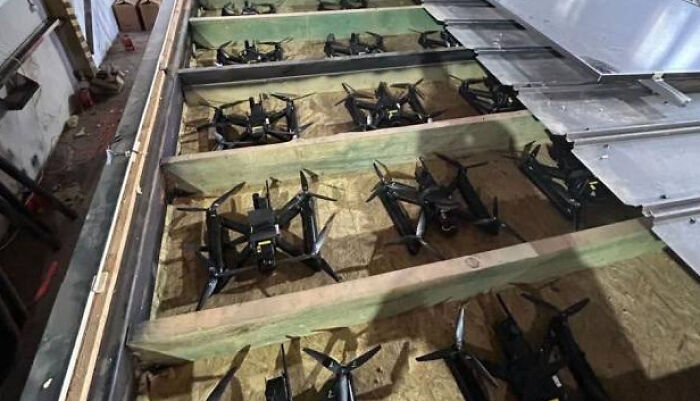 Drones stored in a large wooden crate, illustrating technology trends from headlines that rocked the world in 2025.