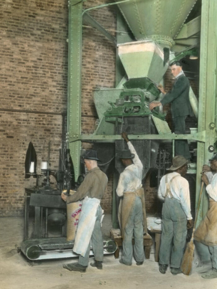 African American workers operating machinery in a 1920s factory showcasing the African American reality of the era.