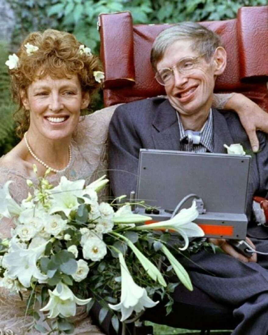 Stephen Hawking smiling with a woman in a wedding setting, unrelated to Epstein Island allegations fact vs fiction.