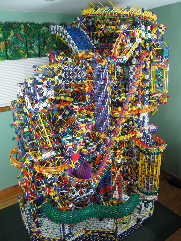Intricate 8-bit computer model built entirely from colorful K’Nex pieces showcasing complex mechanical design indoors. Intricate 8-bit computer model built entirely from colorful K’Nex pieces showcasing complex mechanical design indoors.