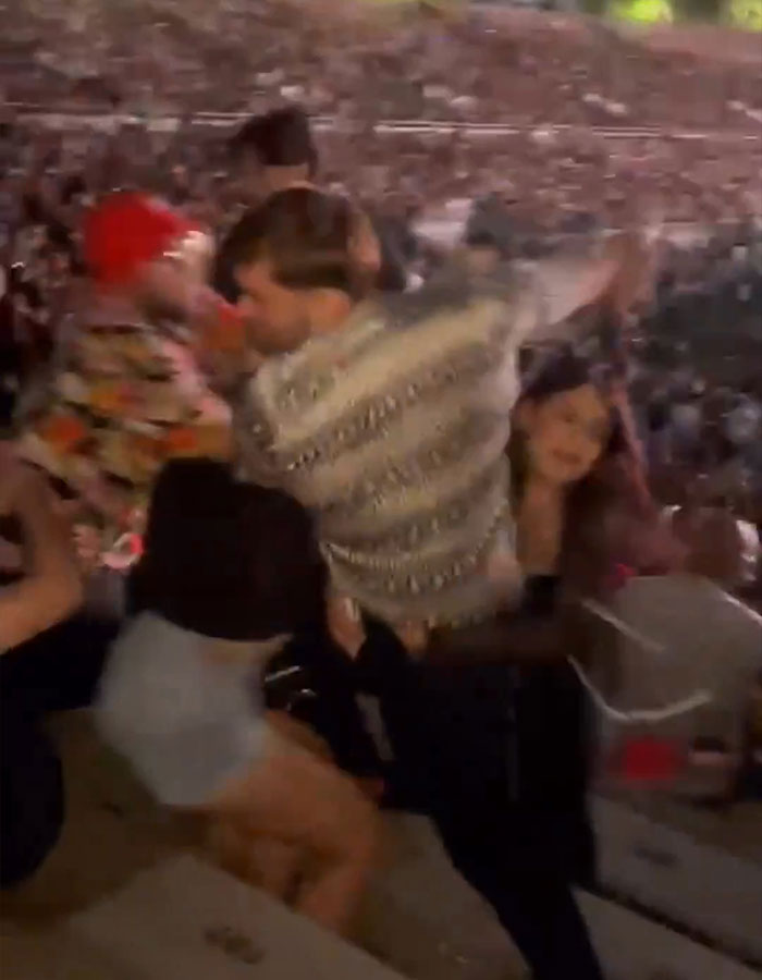 Crowd at concert caught in violent brawl after drink incident, with a mom punched unconscious during the chaos.