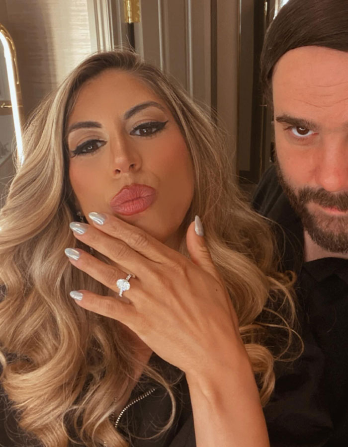 Bride showing engagement ring with groom nearby, capturing moment related to forced marriage or kidnapping story.