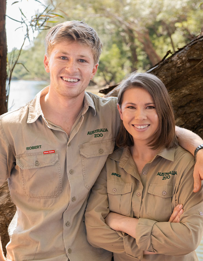 Robert and Bindi Irwin smiling outdoors in Australia Zoo uniforms, related to Steve Irwin’s surprisingly small fortune revealed. - 1