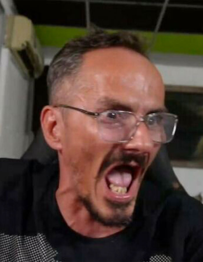 Man with glasses shouting during live stream, capturing moment before streamer's horrifying passing on-air. Man with glasses shouting during live stream, capturing moment before streamer's horrifying passing on-air.