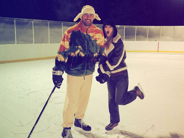 Taylor Swift on ice rink with a man, celebrating the queen of music and new album reveal moment.