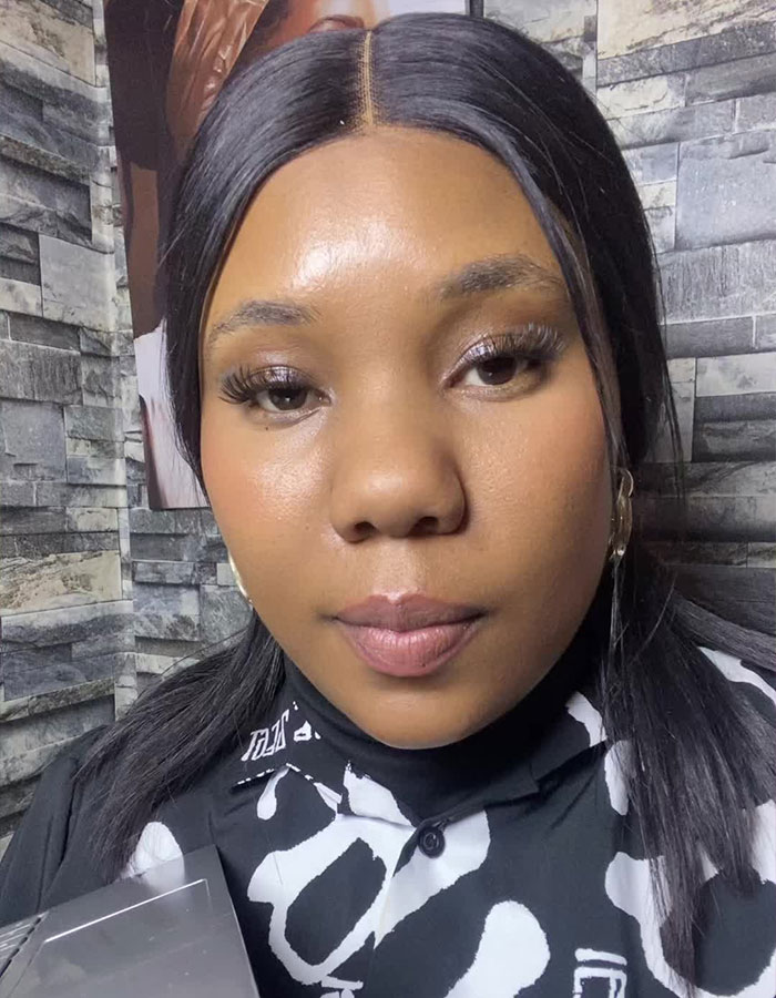 Teacher with long dark hair in patterned shirt filming a viral private parts song for first grade kids indoors. Teacher with long dark hair in patterned shirt filming a viral private parts song for first grade kids indoors.