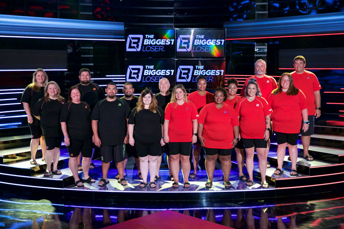 Contestants of The Biggest Loser standing on set, highlighting former participants revealing PTSD in new Netflix documentary.